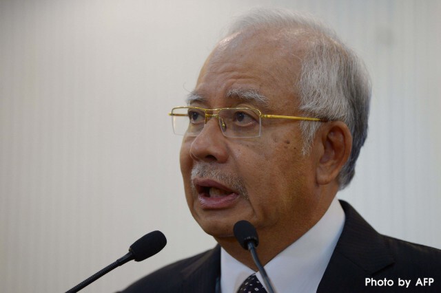 ผู้นำมาเลเซียยืนยันพบชิ้นส่วนปีกเครื่องบิน "MH370"