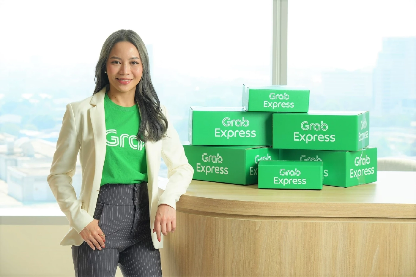 นางสาวเมธิณี อนวัชกุล ผู้อํานวยการฝ่ายธุรกิจการเดินทาง-ขนส่ง และ บริหารพาร์ทเนอร์คนขับ แกร็บ ประเทศไทย