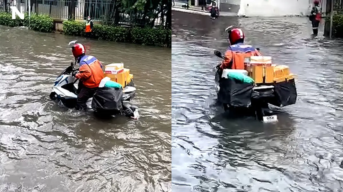 ใจพี่สุดยอดจริง ๆ ขี่รถลุยน้ำท่วมส่งพัสดุ ใจพี่สุดยอดจริง ๆ ขี่รถลุยน้ำท่วมส่งพัสดุ