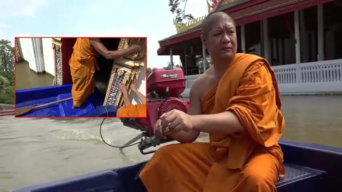สุดทึ่ง! "เจ้าอาวาสวัดตะกู" ขี่เรือหางยาว ปีนโบสถ์ อนุโมทนาผ้ากฐิน (มีคลิป)